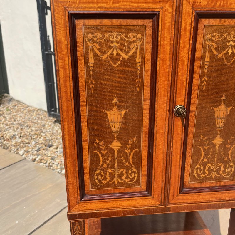 A Fine Quality Edwards and Roberts Of London marquetry inlaid music cabinet